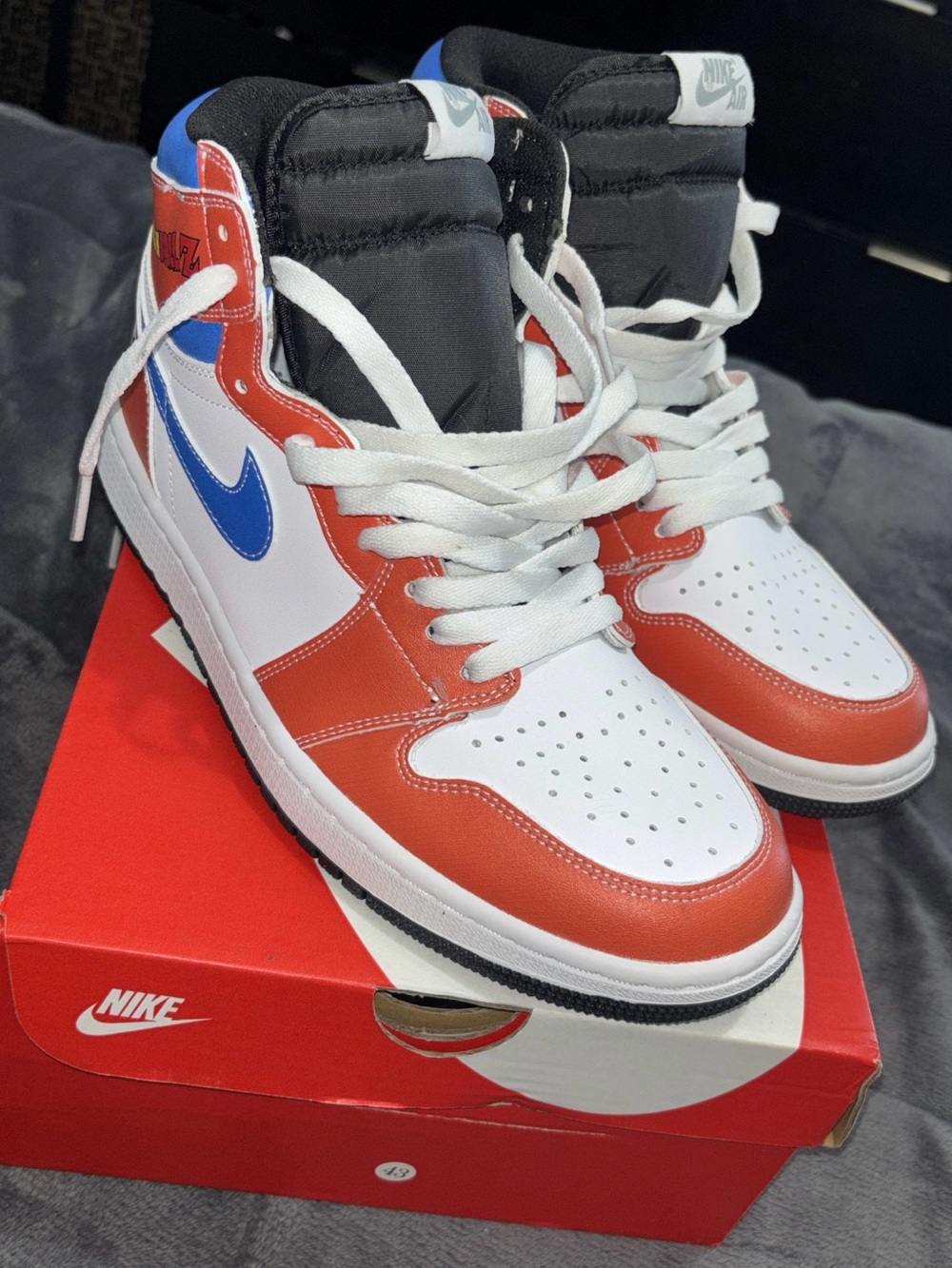 Nike high-top sneakers in white, red & blue